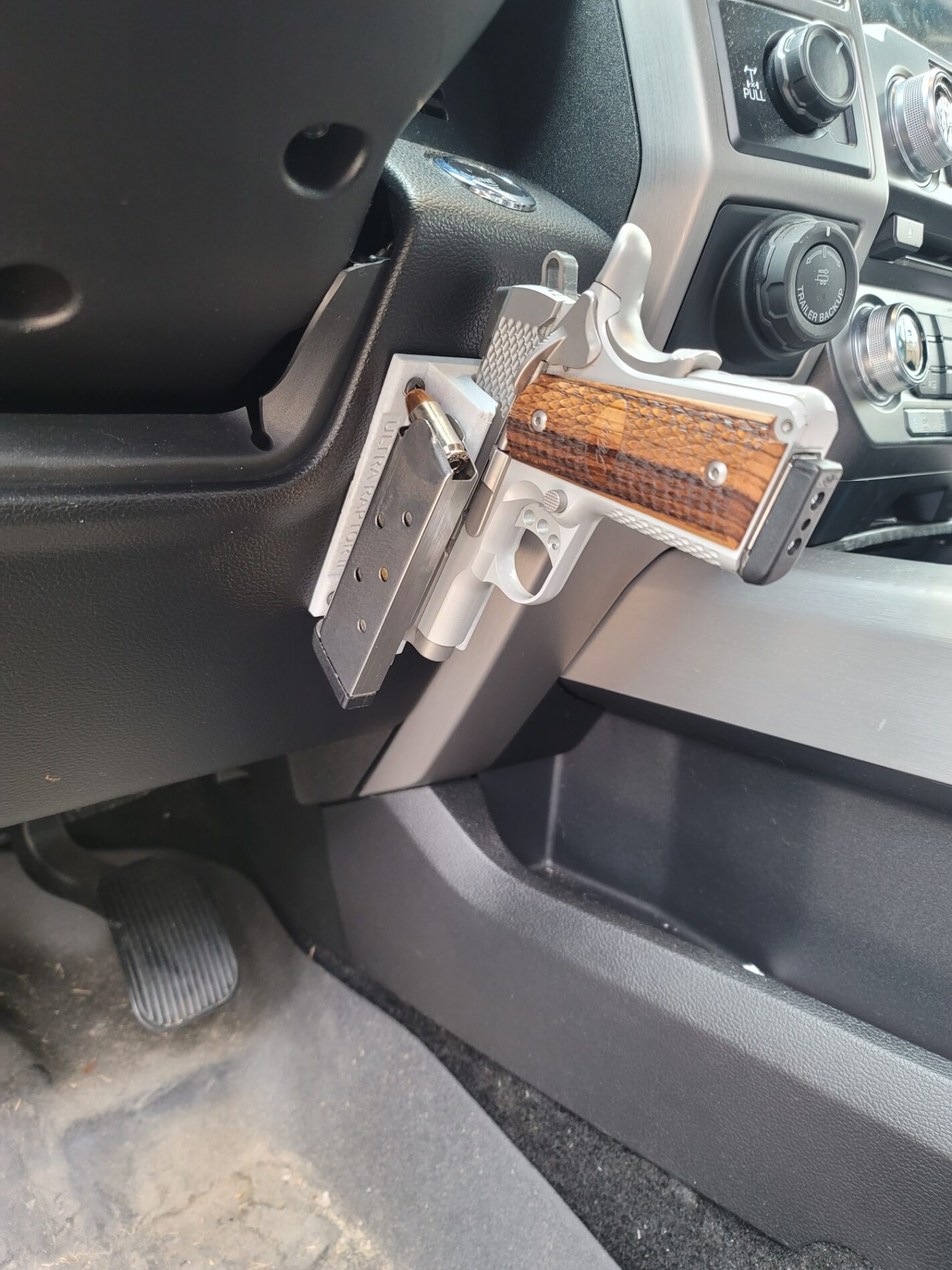 At The Ready side-mounted firearm holder in a truck interior